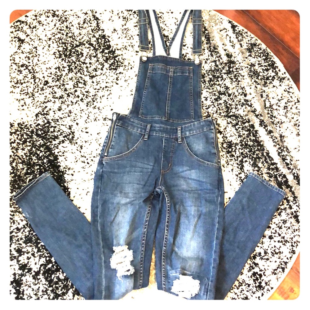 Distressed skinny overalls